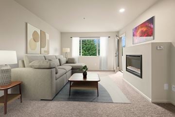 Mill Creek apartment for rent - A living room with a couch, a coffee table, and a painting on the wall.
