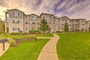 Renton apartment for rent - Apartment complex with a walkway in front at Valley Springs Apartments, Washington, 98058