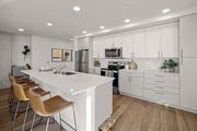 Everett apartment for rent - Modern Open-Concept Kitchen with Island at Riverfront Everett Apartments