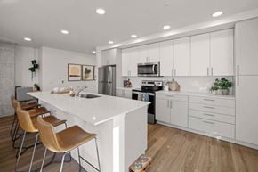 Everett apartment for rent - Modern Open-Concept Kitchen with Island at Riverfront Everett Apartments