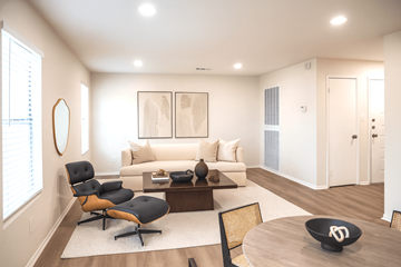 Memphis apartment for rent - A modern living room with a black chair and a white couch.