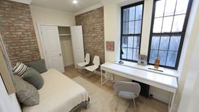 Brooklyn apartment for rent - A bedroom with a bed, desk, and chair.