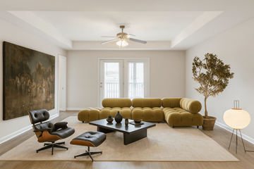 Millington apartment for rent - A living room with a yellow couch and a brown rug.