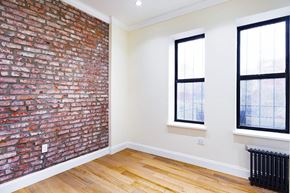 Brooklyn apartment for rent - A room with a brick wall and a window.