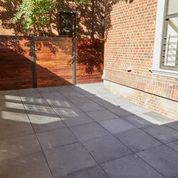 Brooklyn apartment for rent - A black metal pole stands on a sidewalk.