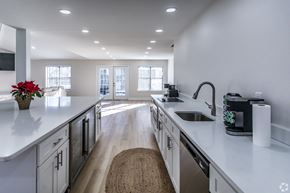 Memphis apartment for rent - A kitchen with white cabinets and a wooden floor.