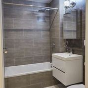 Brooklyn apartment for rent - A white sink is on a counter in a bathroom.