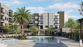 Avondale apartment for rent - A modern apartment complex with a pool in the foreground.
