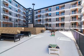 Decatur apartment for rent - A playground area with a slide and a bench in front of apartment buildings.