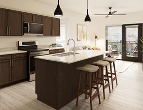Avondale apartment for rent - A kitchen with a white countertop and brown cabinets.