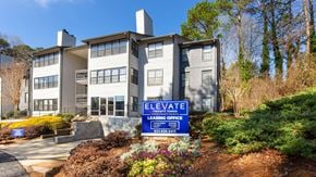 Smyrna apartment for rent - A modern building with a sign that says "ELEVATE" and "LEASING OFFICE" in front of it.