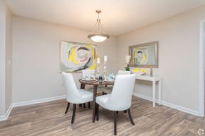 Stockbridge apartment for rent - A dining room with a table set for two and a painting on the wall.