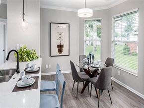 Granger apartment for rent - A dining room with a table set for two and a view of a backyard.