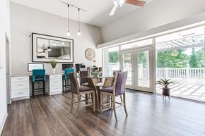 Marietta apartment for rent - A dining room with a wooden table and chairs.