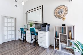 Marietta apartment for rent - A room with a desk, chair, and a large clock on the wall.