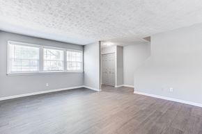 Marietta apartment for rent - A room with a wooden floor and a white ceiling with a window.