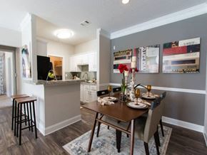 Mcdonough apartment for rent - A kitchen with a dining table set for four.