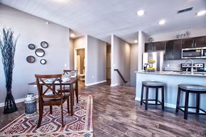 Goshen apartment for rent - A dining room with a wooden table and chairs.