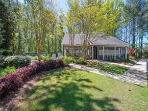 Douglasville apartment for rent - A house with a front yard and trees.