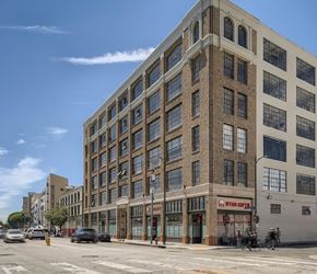 Los Angeles apartment for rent - A large brick building with a Star Gifts store on the ground floor.