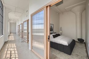 Los Angeles apartment for rent - A bedroom with a bed, a window, and a door.