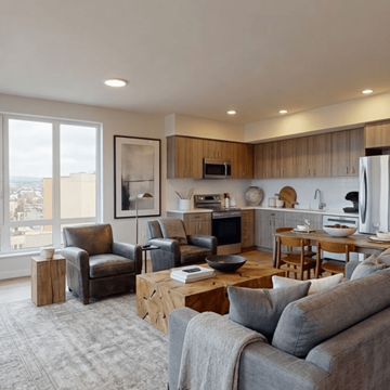 Everett apartment for rent - A modern living room with a grey couch and a wooden coffee table.
