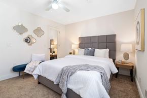 Chesterfield apartment for rent - A bedroom with a large bed and a ceiling fan.