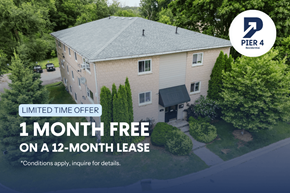 London apartment for rent - A building with a sign that says "PIER 4 Business" and "1 MONTH FREE ON A 12-MONTH LEASE".