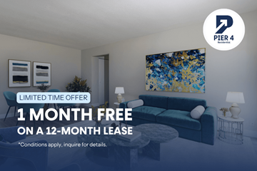 Kitchener apartment for rent - A living room with a couch, a table, and a painting on the wall.