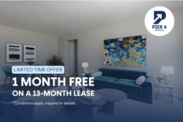Kitchener apartment for rent - A living room with a couch, a table, and a painting on the wall.