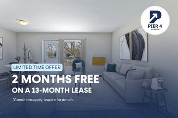 London apartment for rent - A living room with a couch and a chair, advertising a limited time offer for a free 2 months on a 13-month lease.
