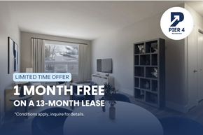 Halifax apartment for rent - A room with a large window and a flat screen TV is on display for a limited time offer.