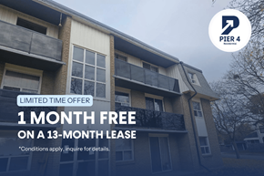 Cambridge apartment for rent - A building with a sign offering a free month on a 13-month lease.