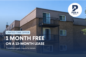 Dartmouth apartment for rent - A building with a sign offering a free month on a 13-month lease.