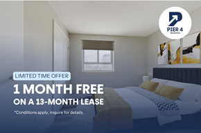 Waterloo apartment for rent - A bedroom with a bed, pillows, and a window with blinds.