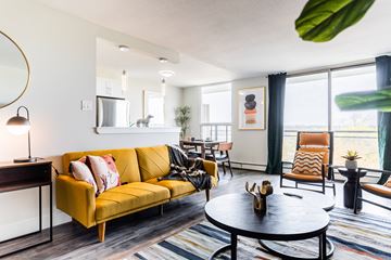 London apartment for rent - A living room with a yellow sofa and a coffee table.