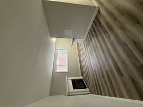 London apartment for rent - A room with a window and a skylight.