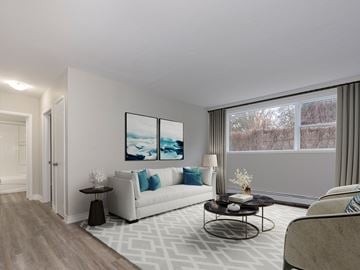 London apartment for rent - A living room with a white sofa and a coffee table.