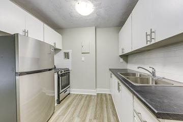 Cambridge apartment for rent - A kitchen with a stainless steel refrigerator and oven.