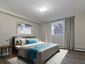 London apartment for rent - A bedroom with a large bed and a painting on the wall.