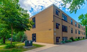 London apartment for rent - A building with the number 390 on it is surrounded by greenery.