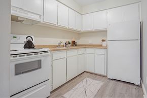 Riverview apartment for rent - A kitchen with white appliances and cabinets.
