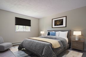 Riverview apartment for rent - A bedroom with a large bed and a painting on the wall.