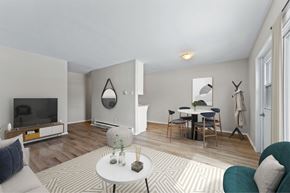 London apartment for rent - A living room with a white coffee table and a grey sofa.