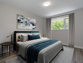 London apartment for rent - A bedroom with a large bed and a painting on the wall.