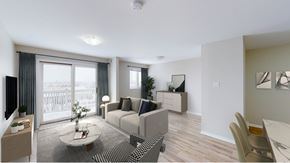 Moncton apartment for rent - A living room with a couch, chairs, and a coffee table.