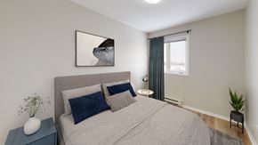 Moncton apartment for rent - A bedroom with a bed, nightstand, and a painting on the wall.