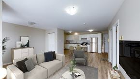 Moncton apartment for rent - A living room with a couch, chair, and a coffee table.