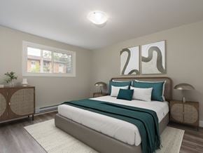 Kitchener apartment for rent - A bedroom with a large bed and a window.