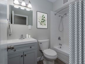 Kitchener apartment for rent - A bathroom with a toilet, sink, and shower.
